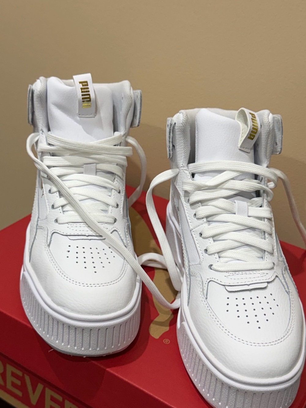 Puma Women’s White High-Top Sneakers with Gold Logo